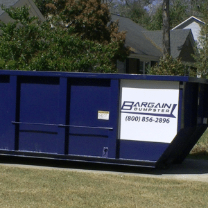 a Bargain Dumpster container in a residential driveway