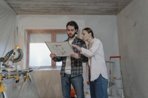 couple in a room with a plan