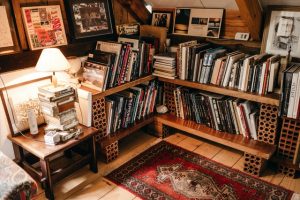 a room with bookshelves and a rug