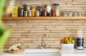 a kitchen with a wooden wall and a wooden sink