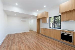 a kitchen with wood floors and a stove