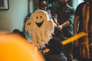 a group of people are playing with a ghost