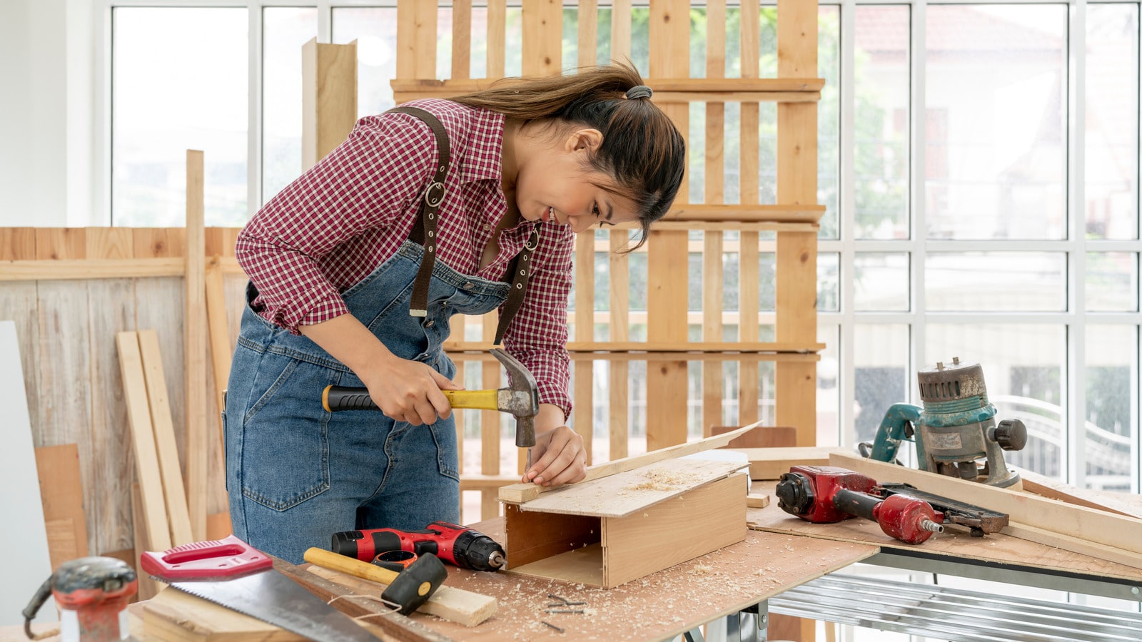 picture of a woman working on a dyi woodworking project