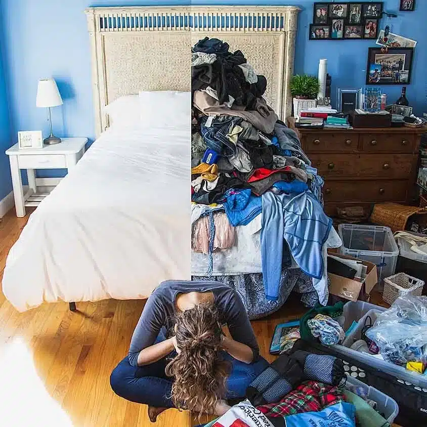 woman sitting on the floor overwhelmed by clutter