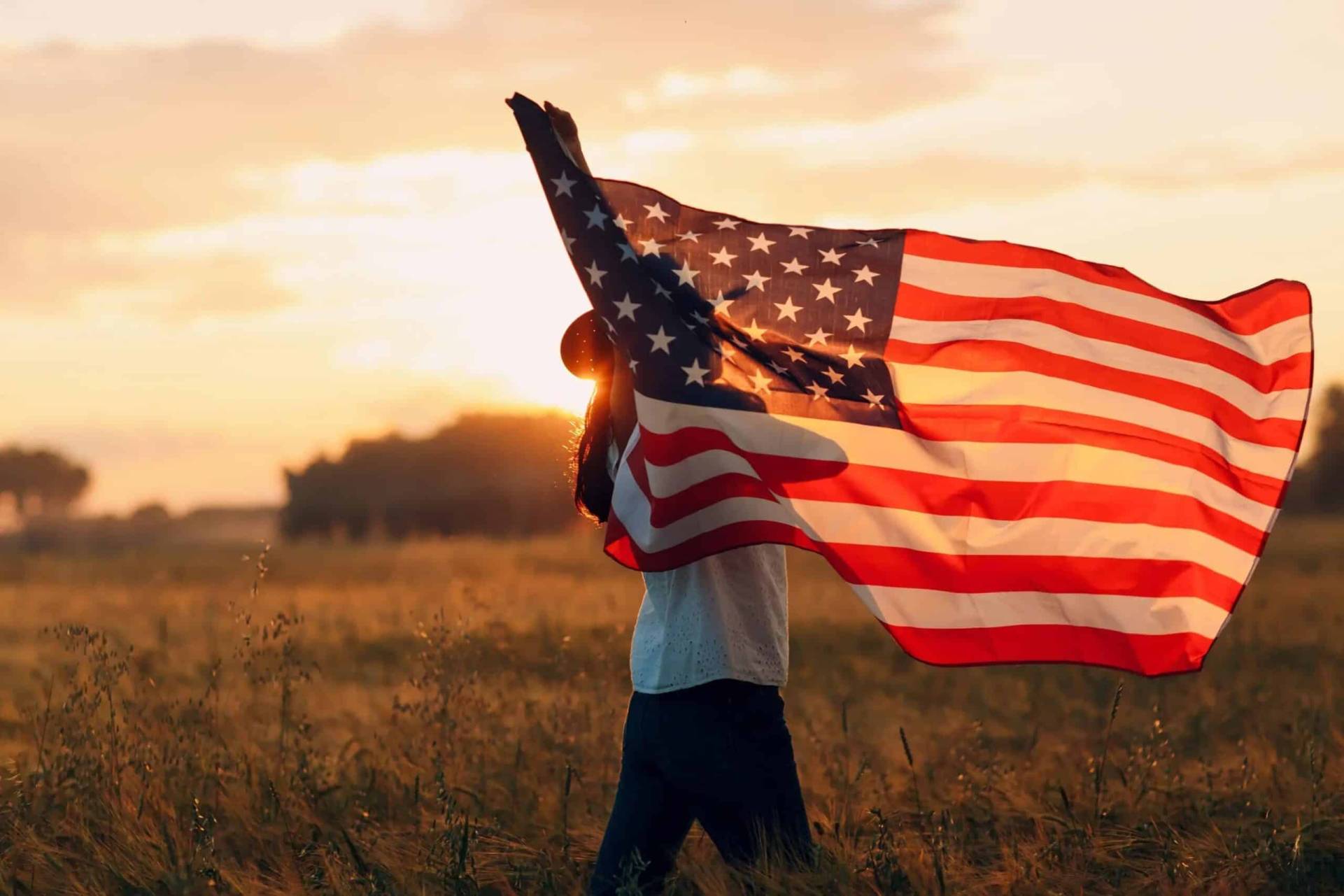 Woman waving an American Flag